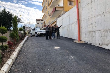 انجاز بناء جدار الدعم وصيانة طريق في التعمير
