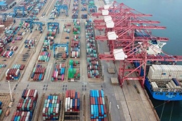 This aerial photo taken on July 14, 2020 shows containers stacked at a port in Lianyungang in China's eastern Jiangsu province. - Chinese trade enjoyed surprise growth in June as the world slowly emerges from economy-strangling lockdowns, though officials warned of headwinds for recovery owing to the spread of the pandemic. (Photo by STR / AFP) / China OUT