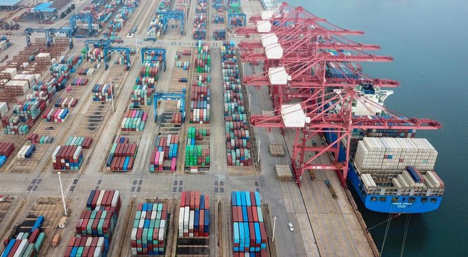 This aerial photo taken on July 14, 2020 shows containers stacked at a port in Lianyungang in China's eastern Jiangsu province. - Chinese trade enjoyed surprise growth in June as the world slowly emerges from economy-strangling lockdowns, though officials warned of headwinds for recovery owing to the spread of the pandemic. (Photo by STR / AFP) / China OUT